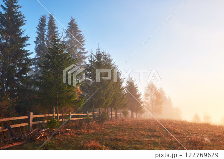 Autumn fog and the beautiful morning sun in a landscape 122769629