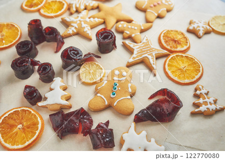 Decorating gingerbread cookies with white icing, selective focus and place for text 122770080
