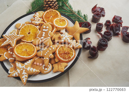 Decorating gingerbread cookies with white icing, selective focus and place for text 122770083