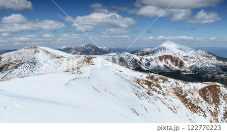 Mysterious winter landscape majestic mountains in winter. Winter road in the mountains. In anticipation of the holiday. Dramatic wintry scene. Carpathian Mysterious winter landscape majestic mountains in winter. Winter road in the mountains. In anticipation of the holiday. Dramatic wintry scene. Carpathian 122770223
