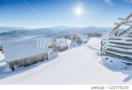 Mysterious winter landscape majestic mountains in winter. Magical winter snow covered tree. Winter road in the mountains. In anticipation of the holiday. Dramatic wintry scene. Carpathian. Ukraine Mysterious winter landscape majestic mountains in winter. Magical winter snow covered tree. Winter road in the mountains. In anticipation of the holiday. Dramatic wintry scene. Carpathian. Ukraine 122770233