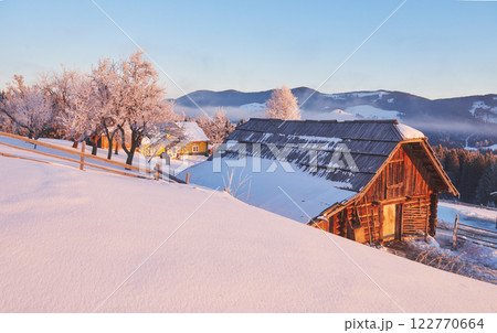 winter landscape trees and fence in hoarfrost, background with snow flakes winter landscape trees and fence in hoarfrost, background with snow flakes 122770664