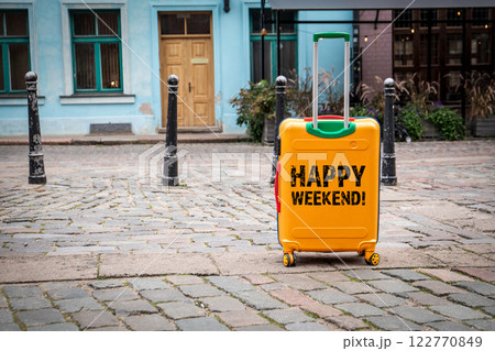 Happy Weekend. Travel suitcase in the old town 122770849