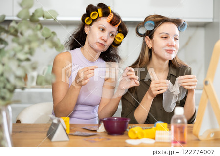 Adult and young women use face masks 122774007