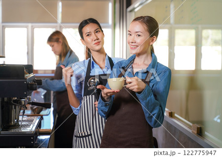 Group young woman people leaning and education workshop for classes barista coffee in cafe room.  122775947