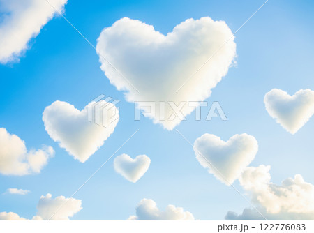 Fluffy heart-shaped clouds in a clear blue sky Fluffy heart-shaped clouds in a clear blue sky 122776083