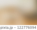 Abstract blurred image with warm brown tones and soft grainy texture 122776094