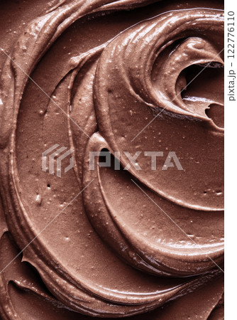 Rich, creamy chocolate swirl texture with smooth and velvety surface 122776110