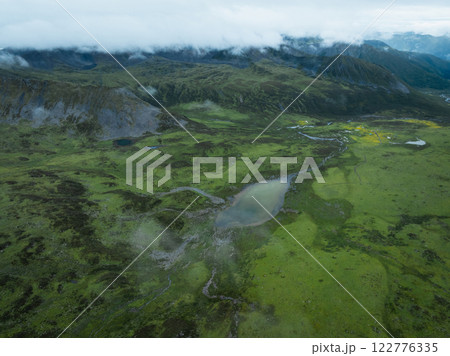 Aerial view of beautiful high altitude grassland mountain landscape Aerial view of beautiful high altitude grassland mountain landscape 122776335