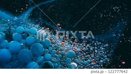 Acrylic bubble. Fizzy fluid. Blue black foam ink dark water art flow. Bursting oil particles spilling color drops blur abstract background. 122777642