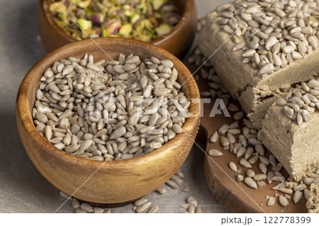 halva made from roasted sunflower seeds and crushed into one solid mass halva made from roasted sunflower seeds and crushed into one solid mass 122778399