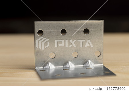 metal corner for connecting wooden parts with screws metal corner for connecting wooden parts with screws 122778402