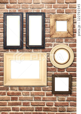 Vertical banner with blank picture frames hanging on brick wall. Empty photo frame set on wall background. Mock up poster frame template for decor room. Retro Interior design. Copy space for text Vertical banner with blank picture frames hanging on brick wall. Empty photo frame set on wall background. Mock up poster frame template for decor room. Retro Interior design. Copy space for text 122781545
