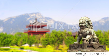 Horizontal background with pavilion, mountain and ancient chinese lion statue. Bronze guardian lion and picturesque landscape, China. Topic of vacation, travel, trip abroad on vacation, cruises, tours Horizontal background with pavilion, mountain and ancient chinese lion statue. Bronze guardian lion and picturesque landscape, China. Topic of vacation, travel, trip abroad on vacation, cruises, tours 122781549