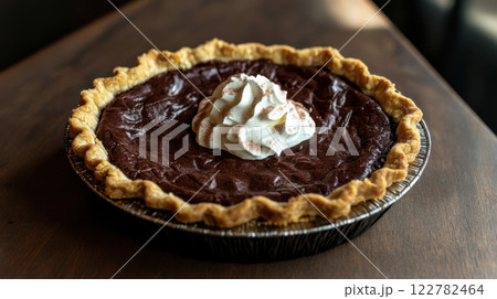Delicious chocolate pie with flaky crust and whipped cream topping Delicious chocolate pie with flaky crust and whipped cream topping 122782464