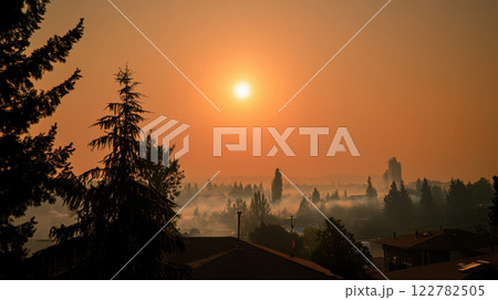 hazy city skyline under smoky sunset, evoking sense of extreme heat 122782505