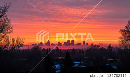 Stunning city skyline at sunrise with vibrant colors and silhouettes 122782513
