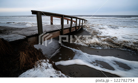 bridge partially collapsed due to rising tides and strong waves bridge partially collapsed due to rising tides and strong waves 122782754