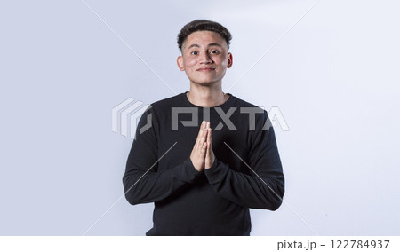 Man asking please, guy putting hands together asking please, worried man apologizing. 122784937