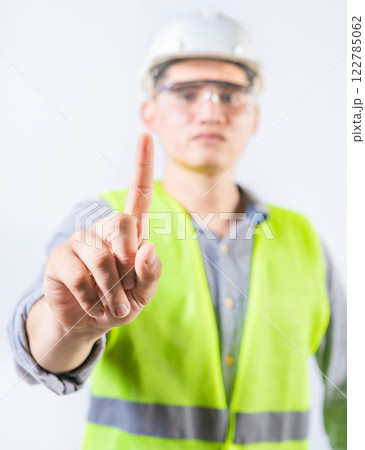 Young engineer counting number one isolated. Male engineer showing number one isolated 122785062