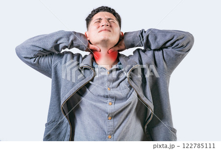 Person with neck pain isolated. Guy suffering with neck pain. Neck pain and stress concept Person with neck pain isolated. Guy suffering with neck pain. Neck pain and stress concept 122785111