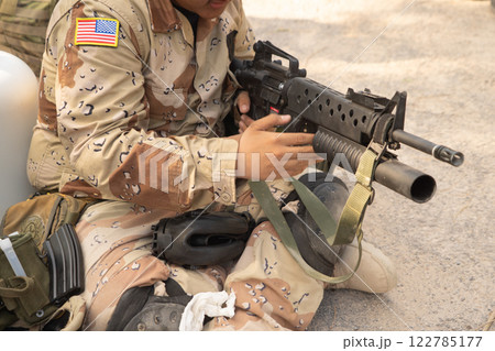 Team of U.S. Army marine corps soldier military war with gun weapon participating and preparing to attack the enemy in Thailand during exercise Cobra Gold training in battle. Combat force. 122785177