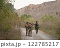 Team of U.S. Army marine corps soldier military war with gun weapon participating and preparing to attack the enemy in Thailand during exercise Cobra Gold training in battle. Combat force. 122785217