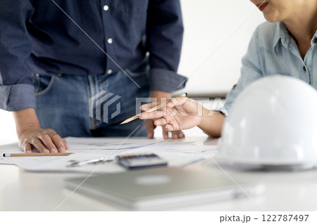 Architect or engineer are discussing and consulting in the office Architect or engineer are discussing and consulting in the office 122787497