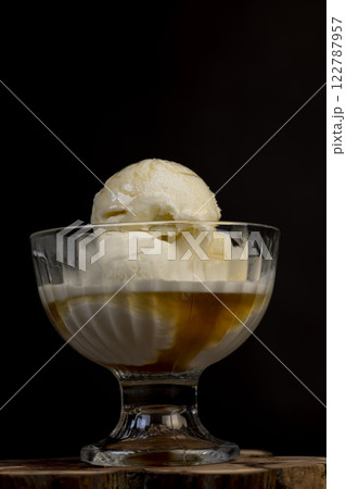 creamy balls of fresh white ice cream with the taste of maple syrup in a glass creamy balls of fresh white ice cream with the taste of maple syrup in a glass 122787957