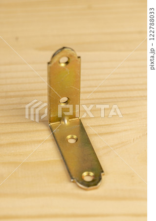 metal corner for connecting wooden parts with screws metal corner for connecting wooden parts with screws 122788033