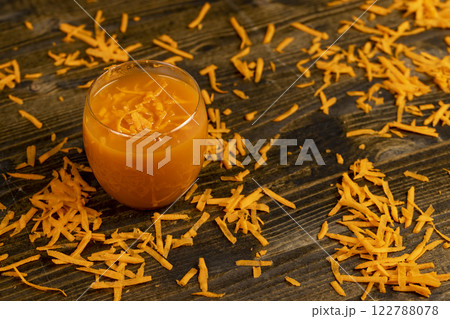 grated orange carrots and fresh carrot juice grated orange carrots and fresh carrot juice 122788078