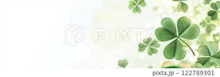 St. Patricks Day clovers and gold coins on green glitter background St. Patricks Day clovers and gold coins on green glitter background 122789301