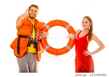 Lifeguards in life vest with ring buoy. Success. Lifeguards in life vest with ring buoy. Success. 122789560