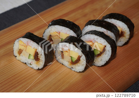 Homemade sushi roll on wood board. Japanese food. 122789710