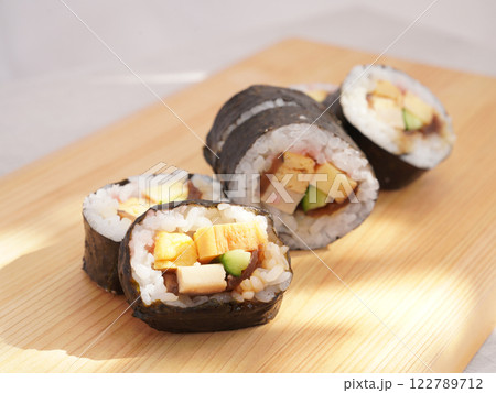 Homemade sushi roll on wood board. Japanese food. 122789712