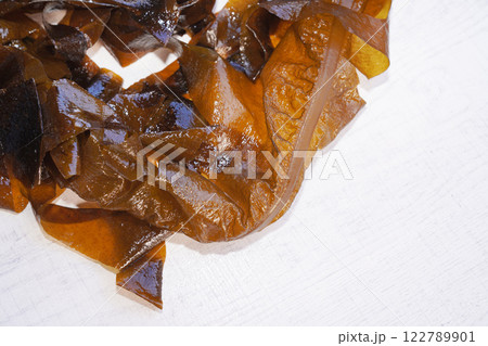 Fresh seaweed wakame on wood background. Japanese food. 122789901