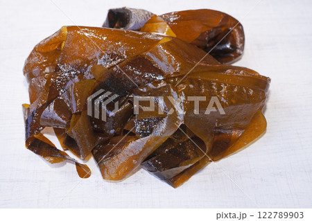 Fresh seaweed wakame on wood background. Japanese food. Fresh seaweed wakame on wood background. Japanese food. 122789903