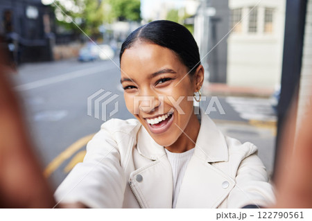 Girl social media influencer taking a selfie portrait on city street outdoors to post it online. Fashion, swag and young woman with a cool white leather jacket happy, smile and smiling on the road Girl social media influencer taking a selfie portrait on city street outdoors to post it online. Fashion, swag and young woman with a cool white leather jacket happy, smile and smiling on the road 122790561