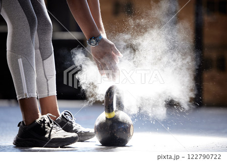 Woman powder hands, kettlebell fitness and ready for gym training, workout and exercise in healthy club. Bodybuilder athlete with power, dust and motivation prepared for heavy performance challenge 122790722