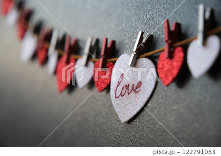 On the heart there is an inscription love next to other hearts On the heart there is an inscription love next to other hearts 122791083