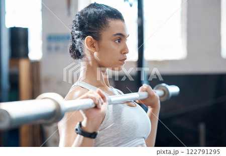 Weight lifting, woman fitness and exercise workout of a bodybuilder with sports motivation and focus. Sport and strength training of a Mexican athlete working out in a wellness, health and gym studio Weight lifting, woman fitness and exercise workout of a bodybuilder with sports motivation and focus. Sport and strength training of a Mexican athlete working out in a wellness, health and gym studio 122791295