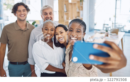 Phone, selfie and teamwork with a business team working in collaboration in their office and taking a picture. Motivation, diversity and photograph with happy friends having fun together at work Phone, selfie and teamwork with a business team working in collaboration in their office and taking a picture. Motivation, diversity and photograph with happy friends having fun together at work 122791508