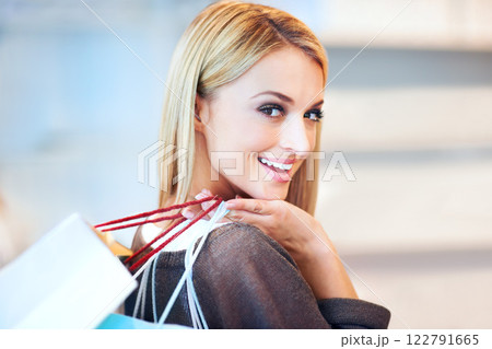 Shopping bags woman with sales, deals and discount designer fashion from retail boutique, mall and beauty store. Portrait of happy housewife, rich customer satisfaction and money to spend on service 122791665