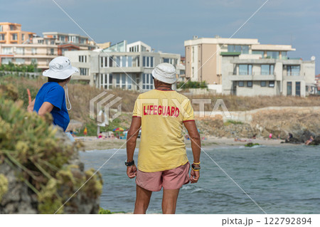 Sozopol, Bulgaria - 09/06/2018: A man in a t-shirt with the inscription lifeguard 122792894