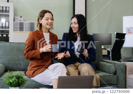 caucasian businesswoman creative talking discussion ideas and enjoys a coffee. 122793000