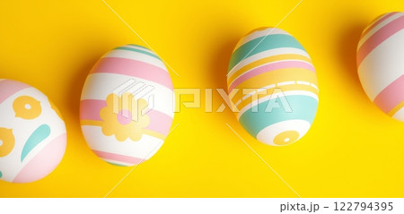 Pastel colored Easter eggs with floral and striped patterns on a vibrant yellow background, festive and decorative theme 122794395
