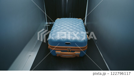 Suitcases and Bags Moving on Conveyor Belt Inside Advanced Metal Detector X-ray Scanner 122796117