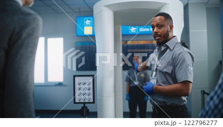Security Officer Gives Instructions to Passengers About TSA Screening Procedures for Boarding Flight Security Officer Gives Instructions to Passengers About TSA Screening Procedures for Boarding Flight 122796277