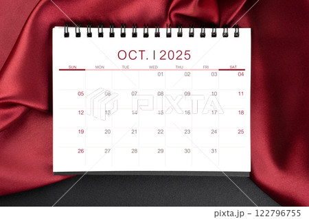 October 2025 Monthly desk calendar with red silk on black leather background. October 2025 Monthly desk calendar with red silk on black leather background. 122796755