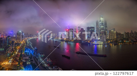 Night view of Shanghai skyline over Huangpu River with colorful reflections 122797617